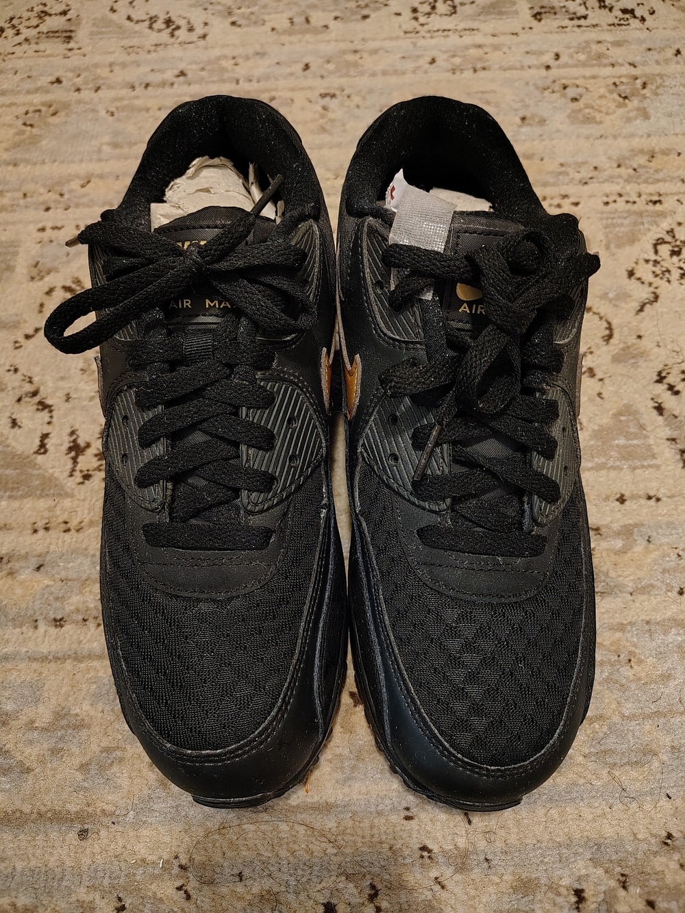 Nike Women's Black Athletic Sneakers with Gold Swoosh